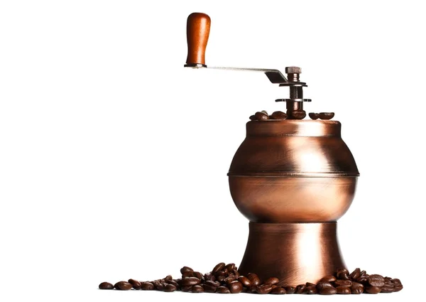 stock image Vintage coffee grinder standing on beans