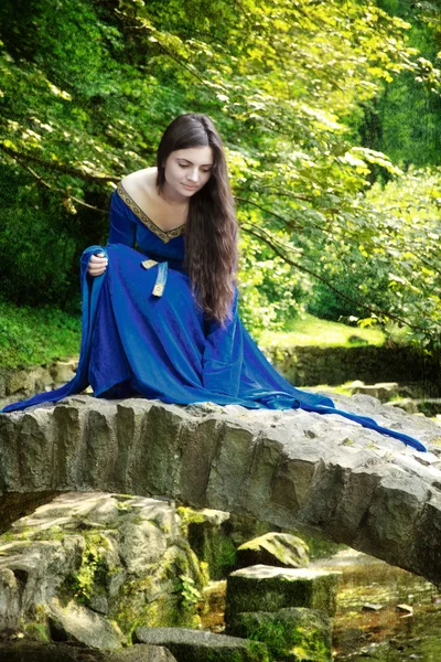 Medieval princess on stone bridge — Stock Photo, Image