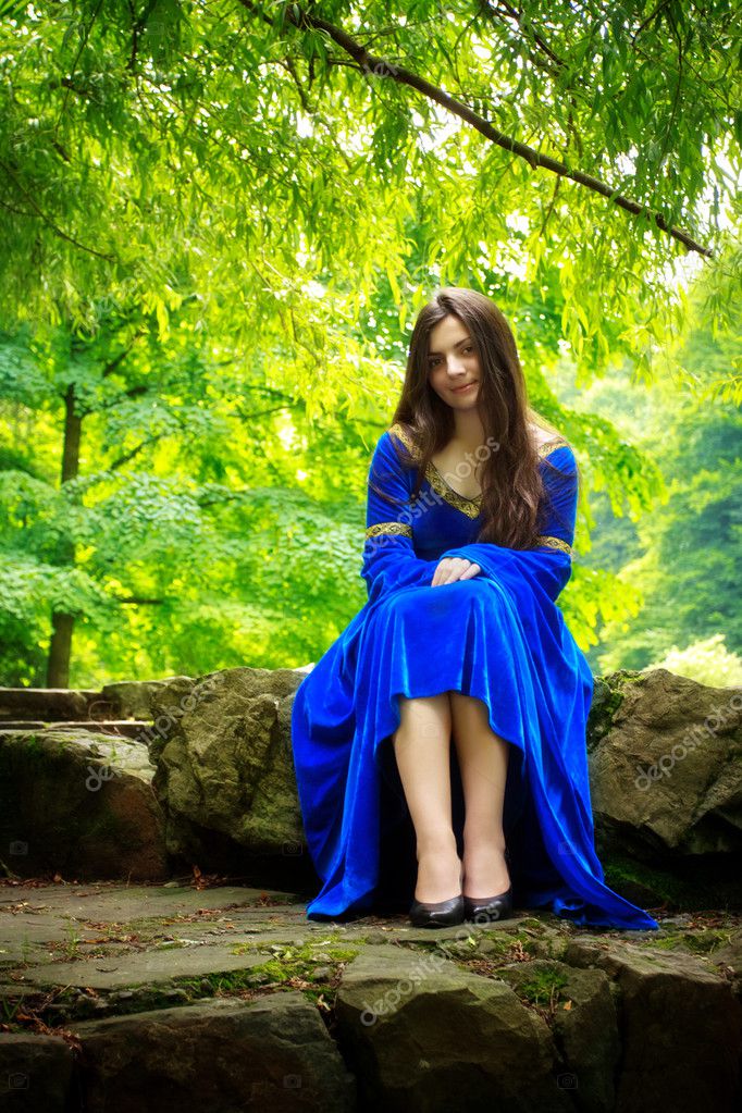 Medieval girl sitting on stone stage — Stock Photo © mr_Brightside #3654851