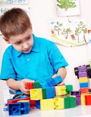 Child with construction set clipart