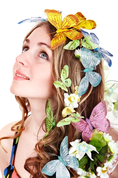 Ragazza con farfalla e fiore sulla testa — Foto Stock