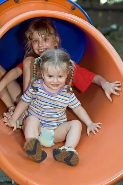 Two children on waterslide. — Stock Photo, Image