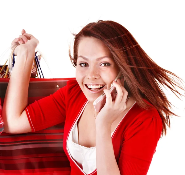 Mujer joven con bolsa de compras y teléfono móvil . — Foto de Stock