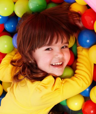 Little girl with group ball. clipart