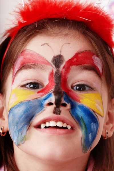 Dziecko z malowania twarzy. — Zdjęcie stockowe