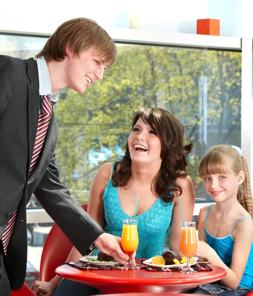 Happy family with child in cafe. — Stock Photo, Image