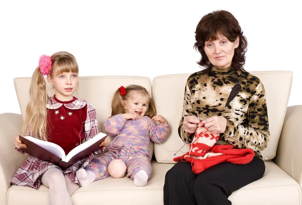 Happy family grandmother knits, child read book. — Stock Photo, Image