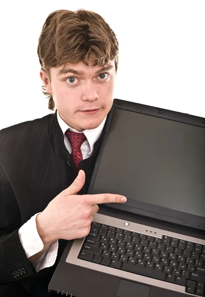 Бизнесмен с ноутбуком в офисе. — стоковое фото