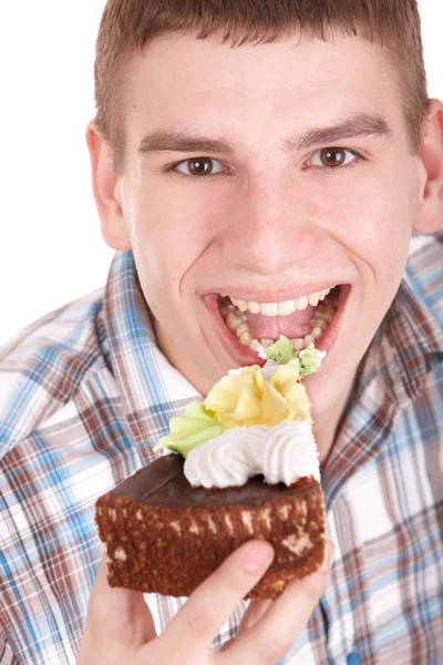 Arc, az ember eszik süteményt. — Stock Fotó