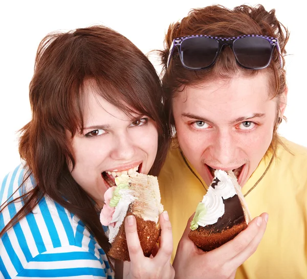 Man and girl eating cake. — Stock Photo, Image