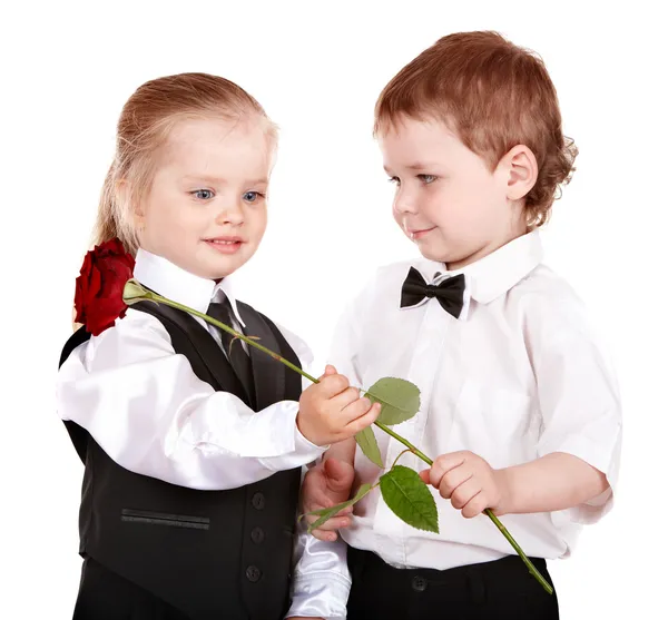 Kinderen in pak met roos. — Stockfoto