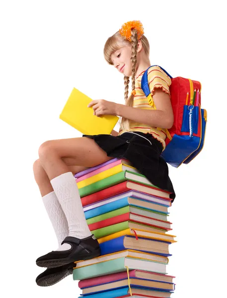 Estudante sentado em pilha de livros . — Fotografia de Stock