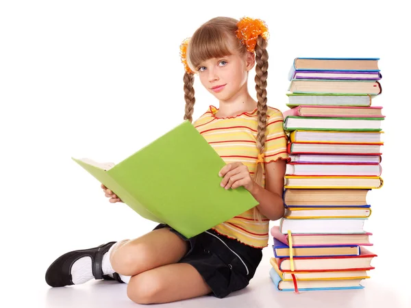 Écolière tenant pile de livres . — Photo
