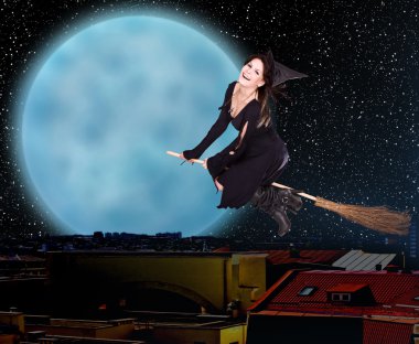 Girl witch fly over city against moon and star sky. clipart