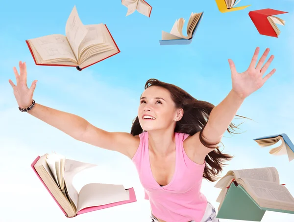 Estudiante chica sosteniendo pila de libros . —  Fotos de Stock