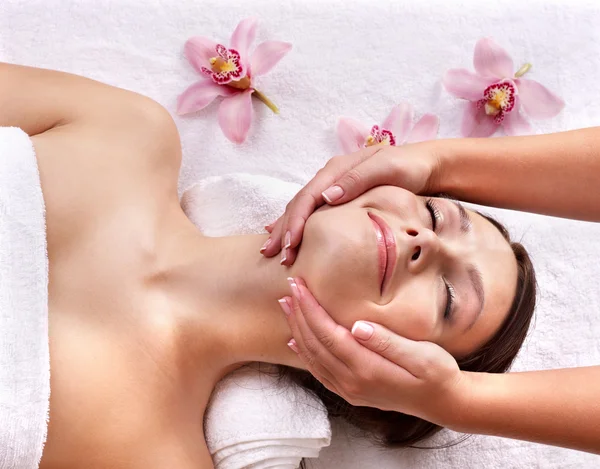 Young woman on massage table in beauty spa. Stock Image