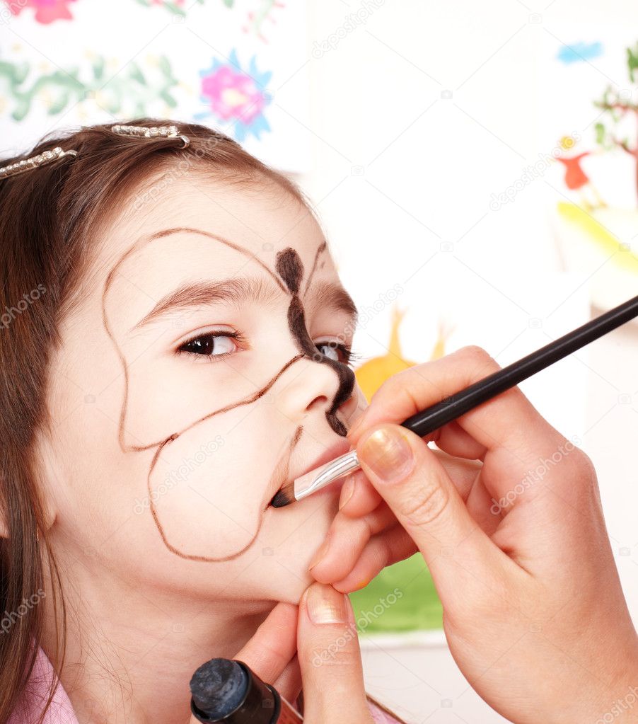 Child with face painting.