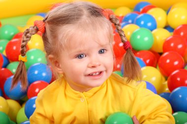 Child in group colourful ball. clipart