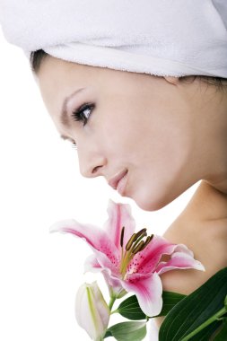 Woman with flower in spa. clipart