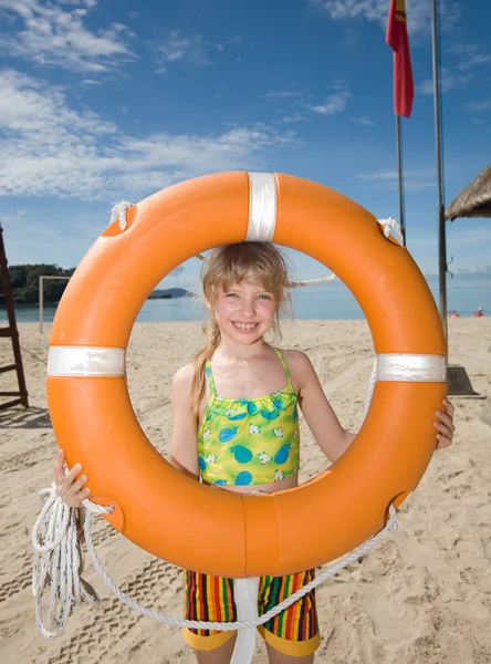 Childl with life buoy at coast. — Stock Photo, Image