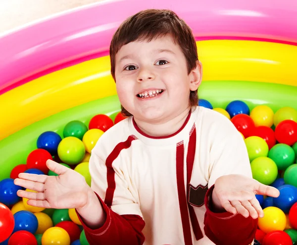 Birthday of happy child in color balls. — Stock Photo, Image