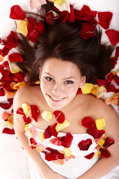 Beautiful happy girl in rose petal. Spa . — Stock Photo, Image