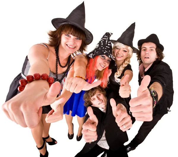 Grupo de em traje de bruxa com polegares para cima . — Fotografia de Stock