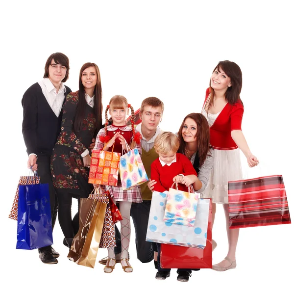 Šťastná rodina s dětmi a nákupní tašky. — Stock fotografie