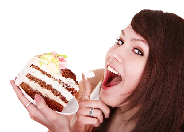Girl eating piece of cake. Stock Picture