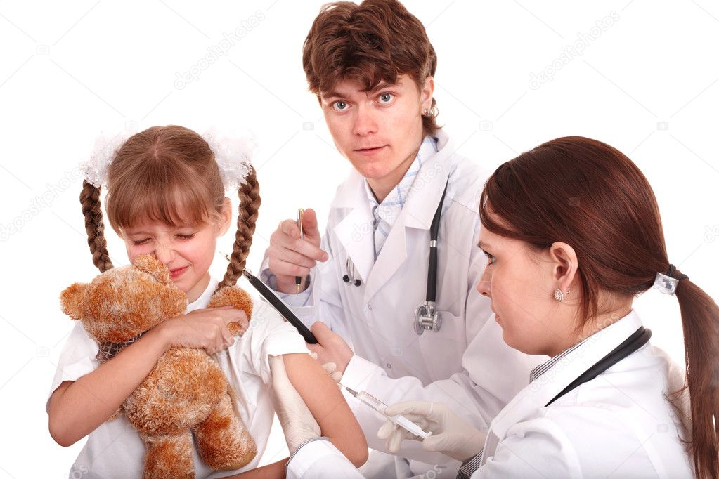 Doctor giving injection to child in arm.