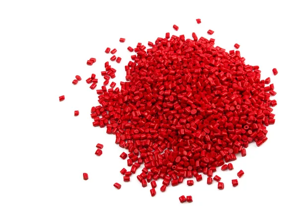 Grânulos de plástico vermelho — Fotografia de Stock