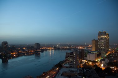 Panorama across Cairo skyline as dusk clipart