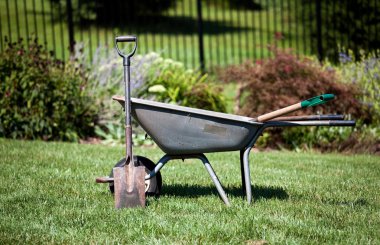 Wheelbarrow and spades clipart