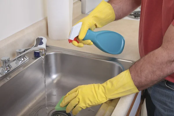 stock image Man cleaning the sink