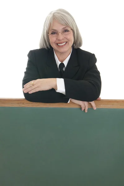 Business woman with blank chalkboard — Stock Photo, Image