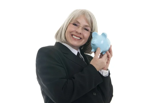 Bonita mulher de negócios segurando um banco porquinho — Fotografia de Stock