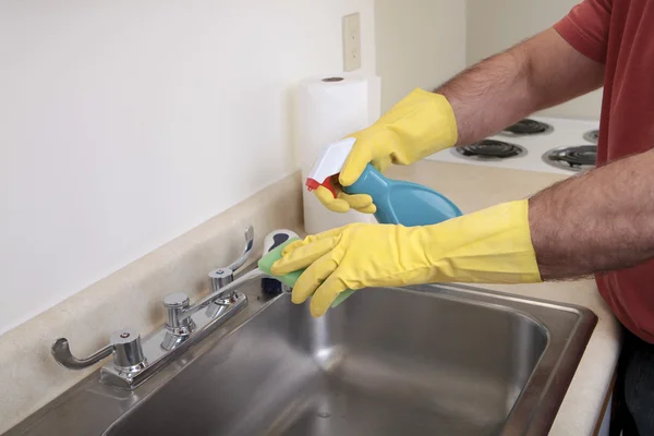 stock image Man cleaning the sink