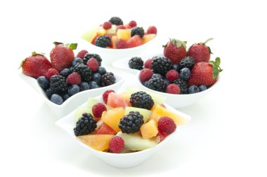 Berries and fruit in bowls clipart