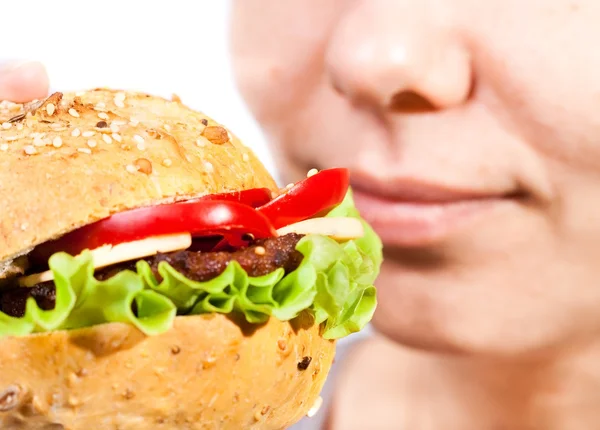 stock image Woman eating hamburger