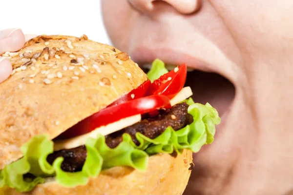 stock image Woman eating hamburger