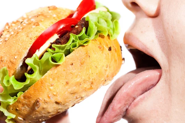 stock image Woman eating hamburger