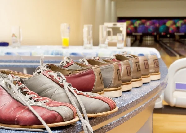 stock image Pairs of bowling shoes lined up in shoe rack