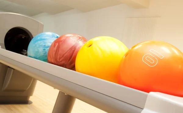 Stock image Bowling balls in a row