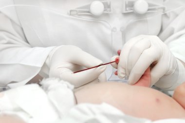 Newly-born child blood sampling clipart