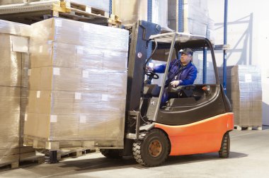 Forklift at work with driver clipart