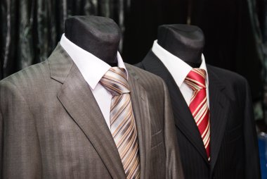 Business suit and ties on a dummy clipart