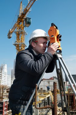 Surveyor with transit level equipment clipart