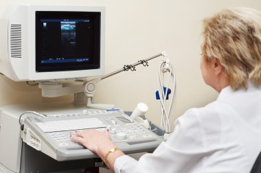 Medic using ultrasound system clipart