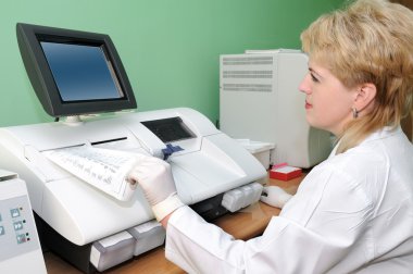 Scientist using medical equipment clipart