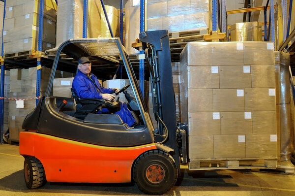 Forklift loader worker at warehouse